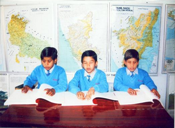AICB photo of students reading BRaille