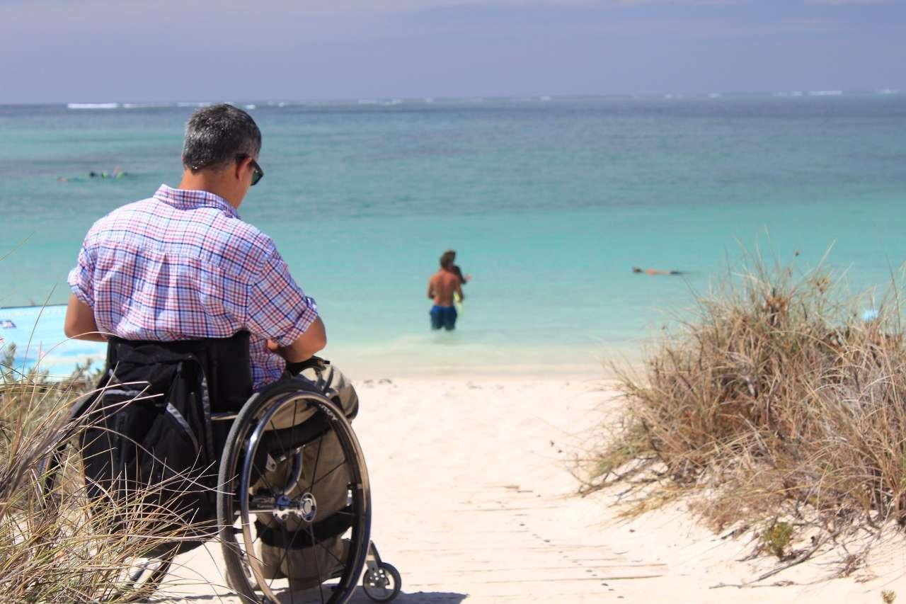Disabled Persons on the wheelchair at near beach 