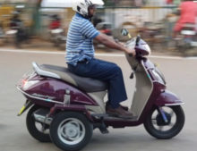 Persons with disabilities drive a honda active with modified