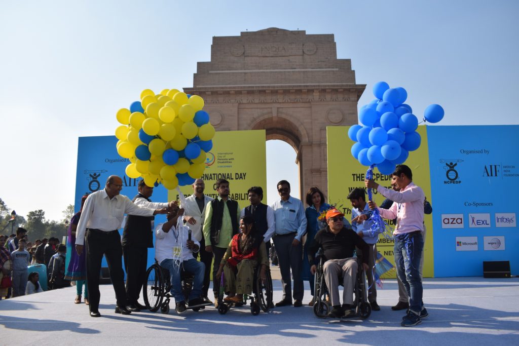 Release of blue and yellow balloons, international colours of disability, symbolising freedom